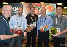 The team of Star Produce proudly shows a variety of products, including strawberries, blueberries, tomatoes, lettuce and cherries.